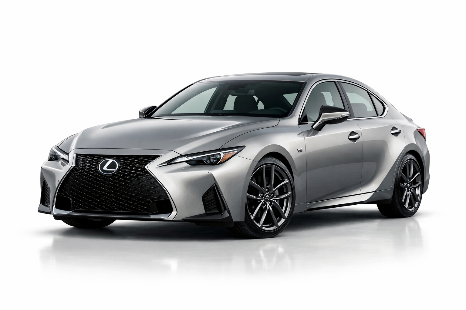 A silver Lexus IS 350 sedan with black wheels is parked on a white studio background, viewed from the front left angle. Always research Lexus IS 350 years to avoid before making your next purchase.