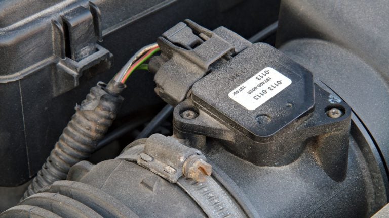 a close up of a car's engine with wires attached.