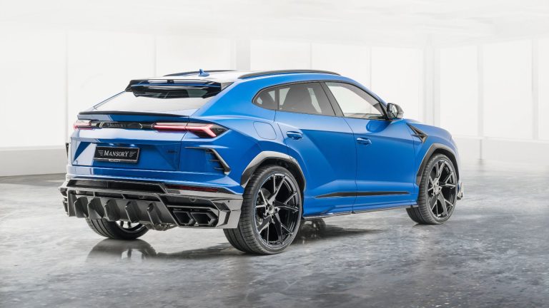 a blue sports car parked in a white room.