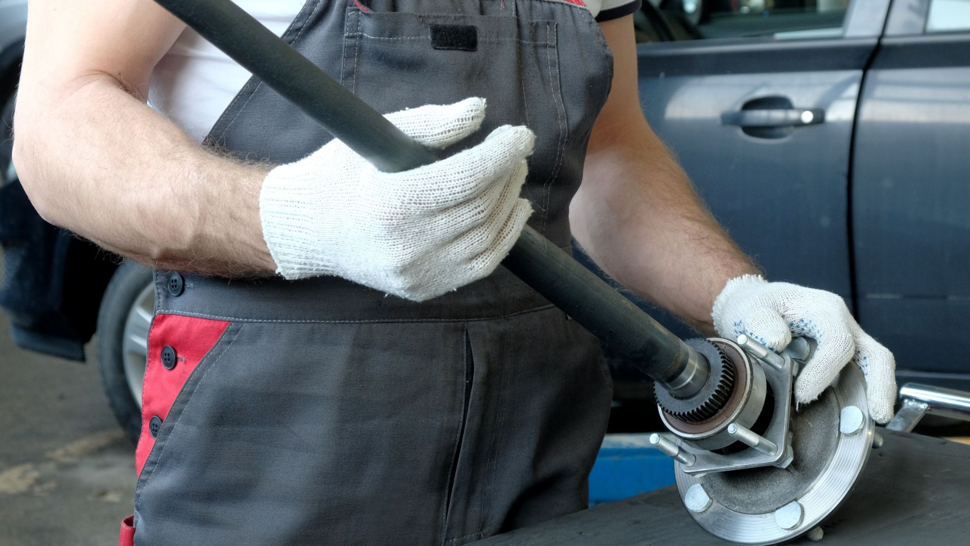 a man holding a wrench in his hands.