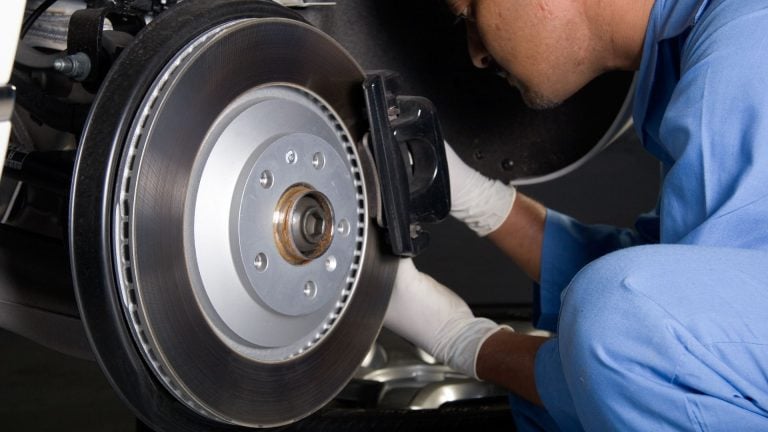 mechanic inspecting brakes 1