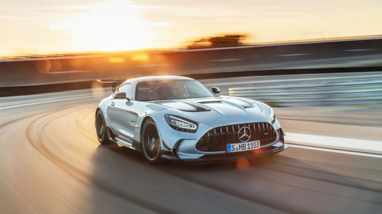 a mercedes sports car driving on a track.