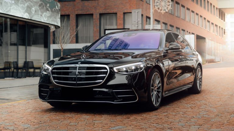 a black car parked in front of a building.