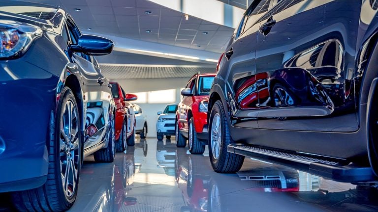 a group of cars parked in a garage.