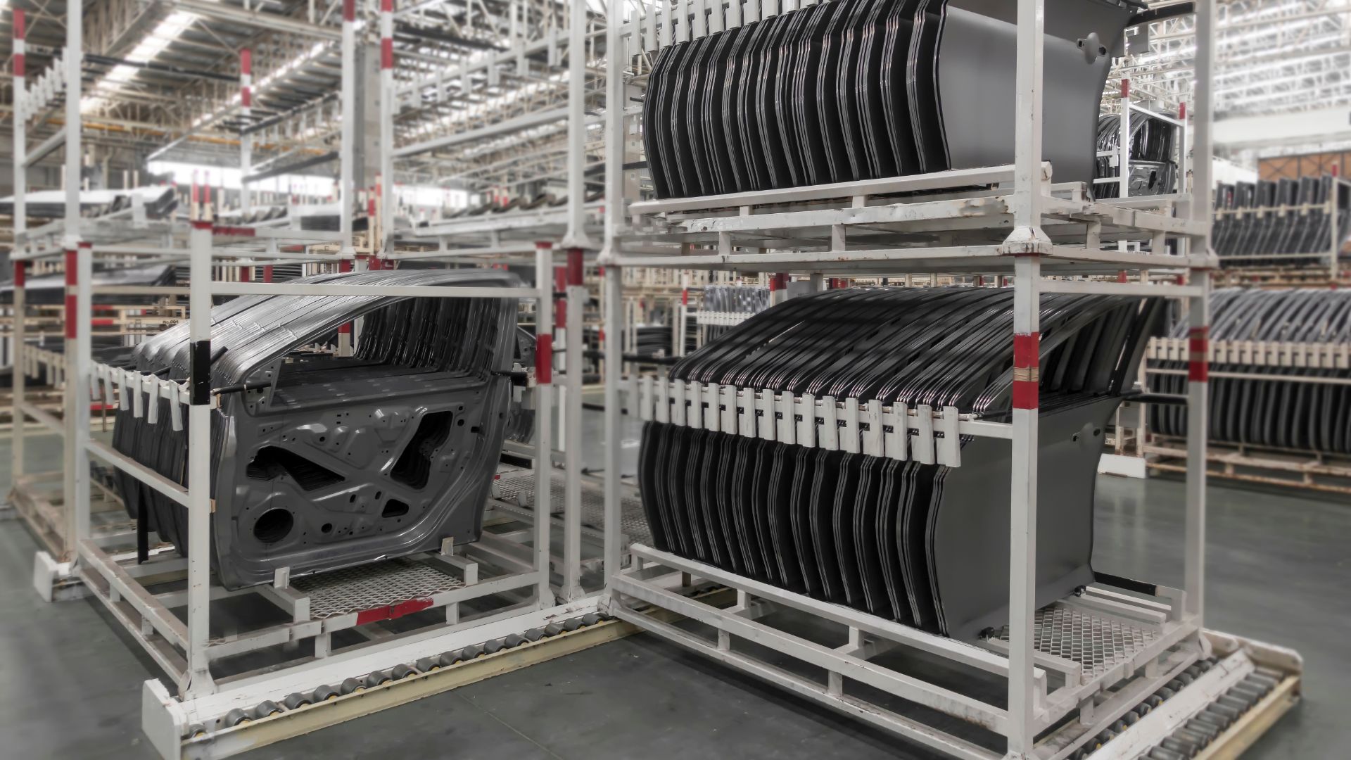 a rack of black and white plates in a warehouse.