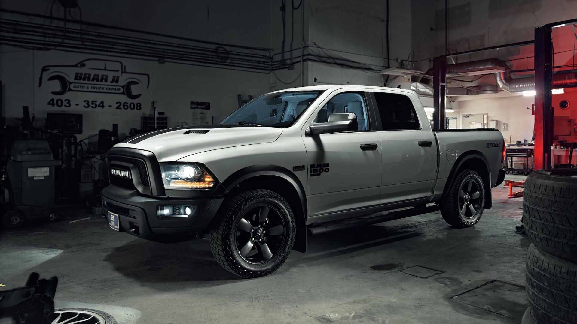 a white truck parked inside of a garage.