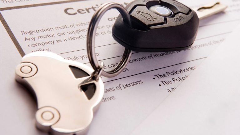 a couple of keys sitting on top of a paper.