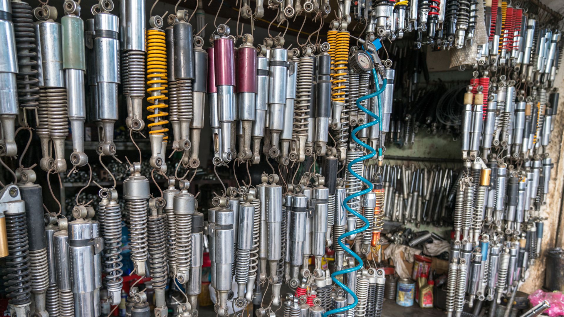 a bunch of different types of wires hanging on a wall.