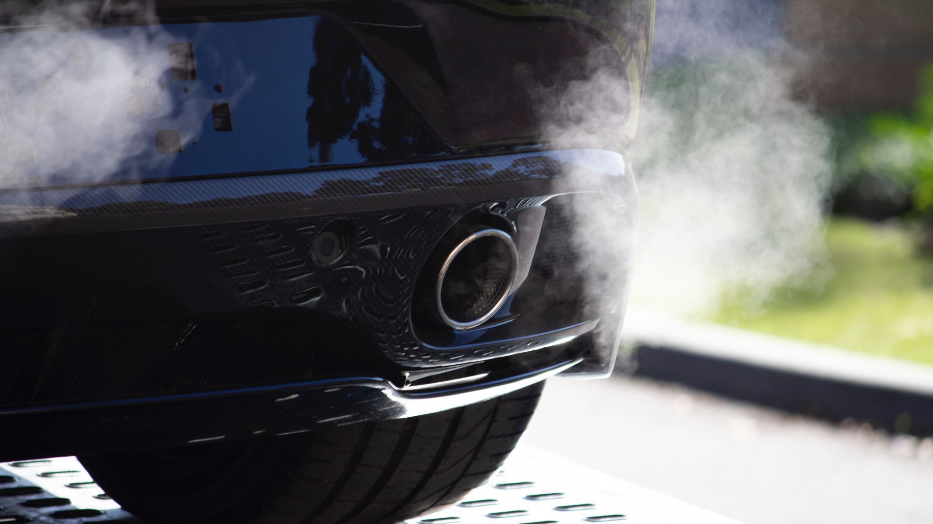 a close up of a car with steam coming out of it.