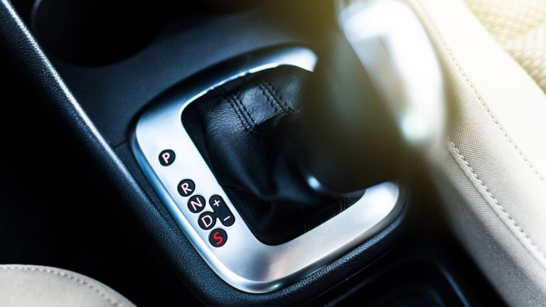 a close up of a button in a car.