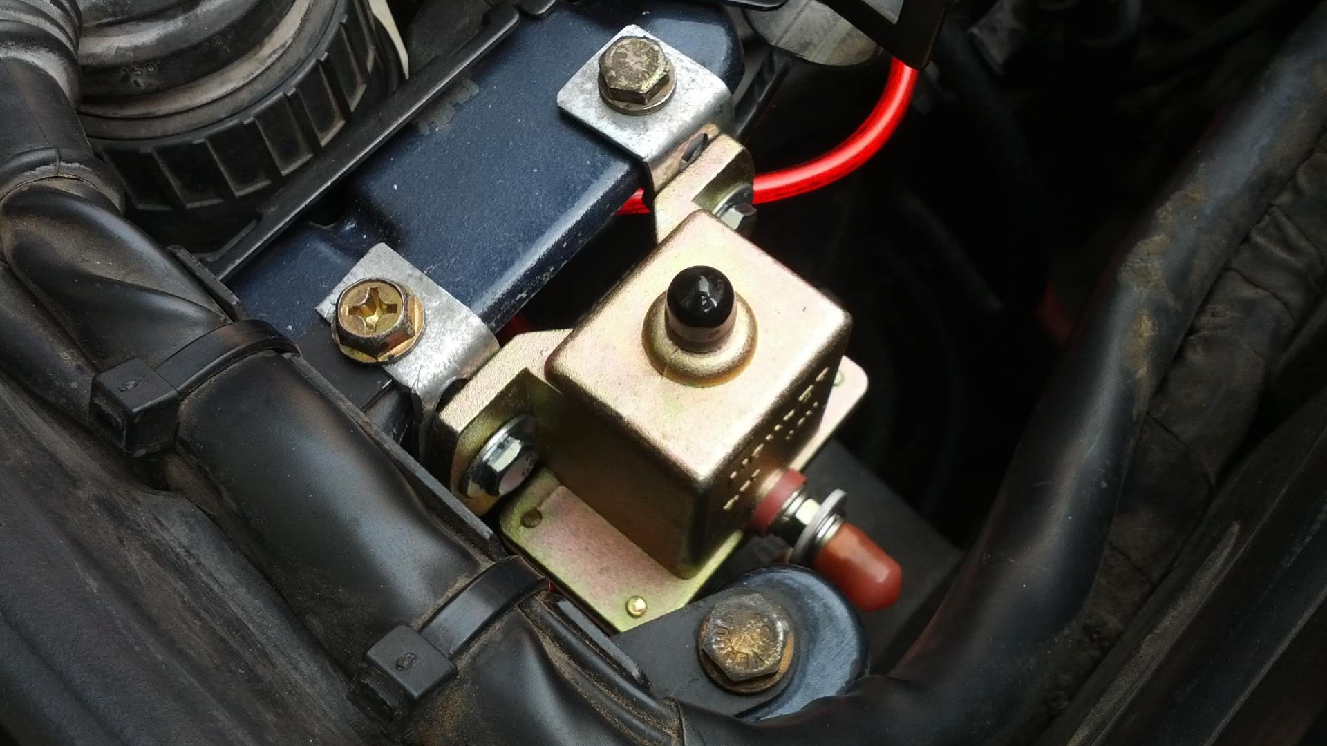 a close up of a car's engine and its wiring.