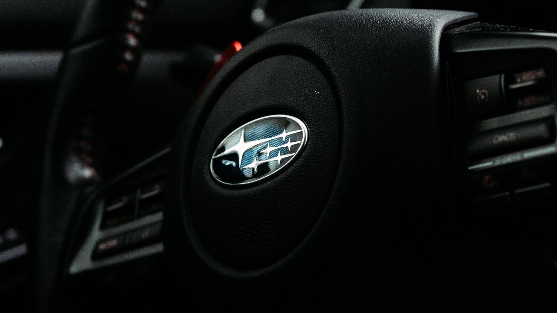 a close up of the steering wheel of a car.