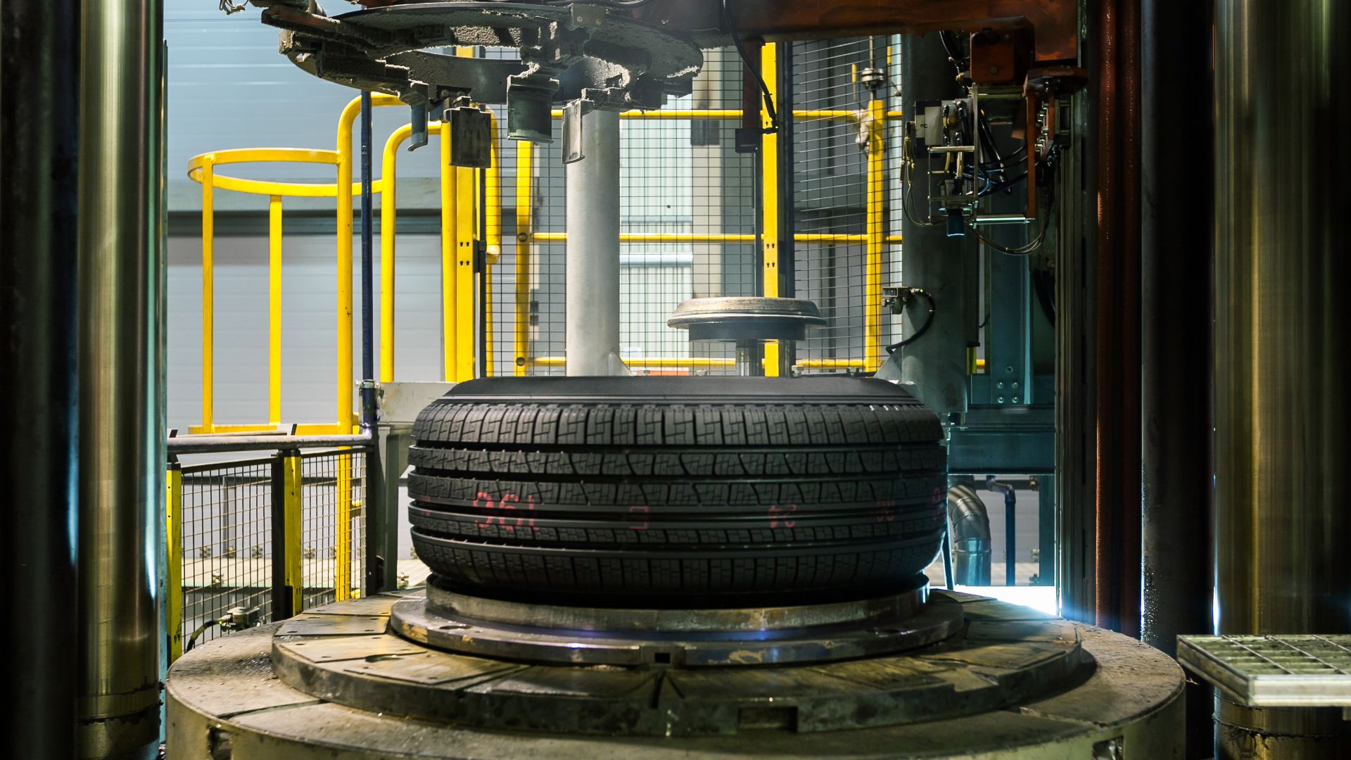 a tire on a machine in a factory.