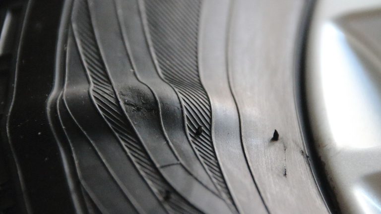 a close up of a car tire with lines on it.
