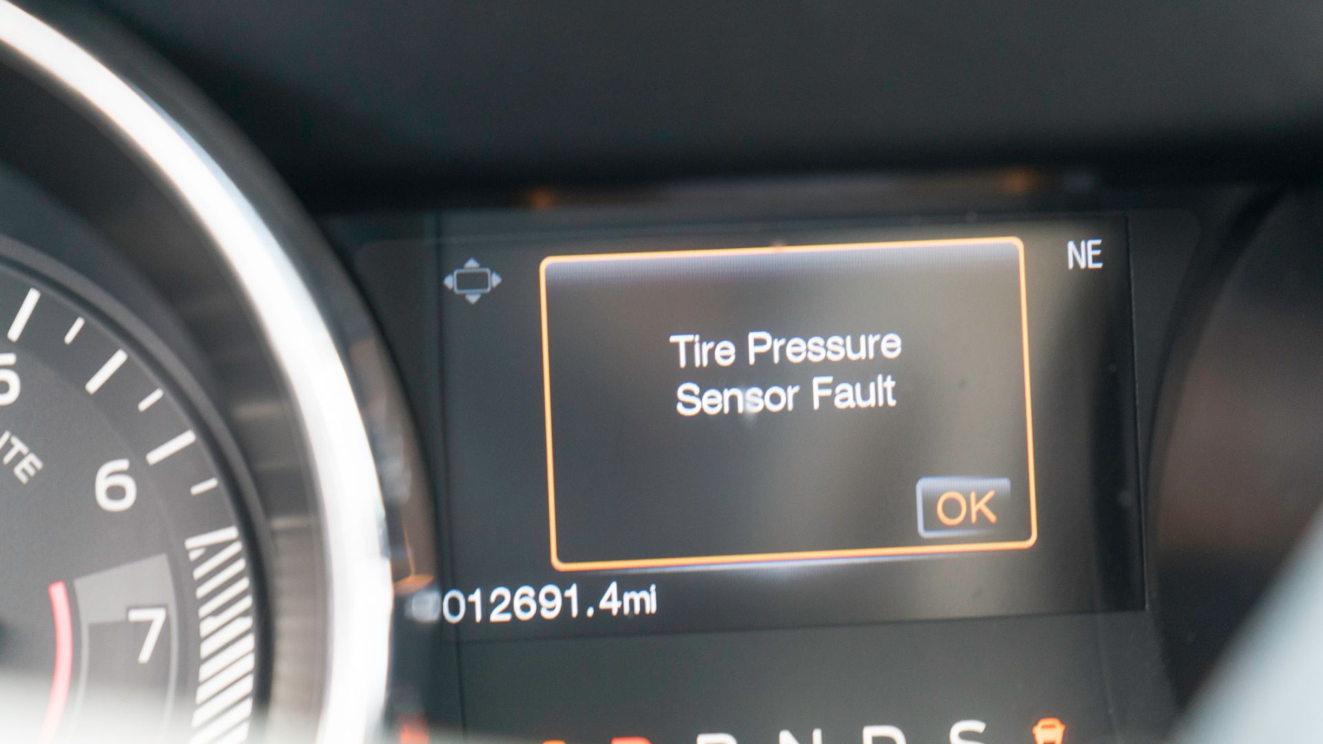 a close up of a gauge on a car.
