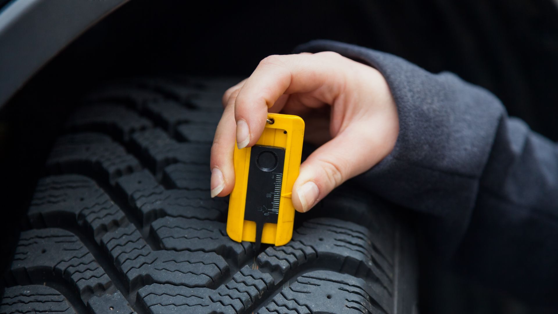 a person holding a yellow device in their hand.