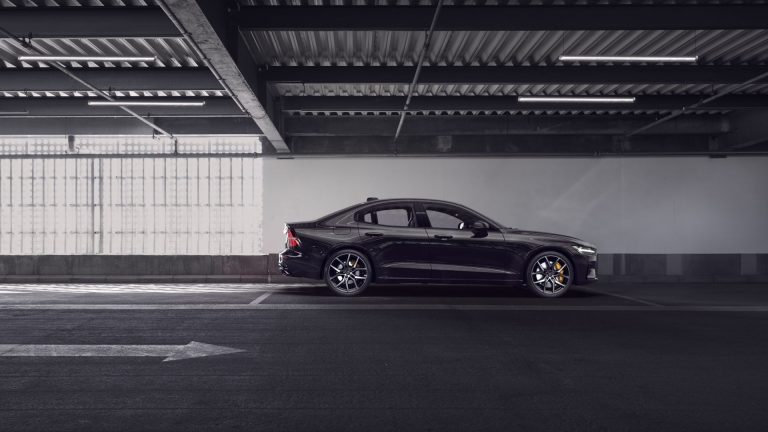 a black car parked in a parking garage.