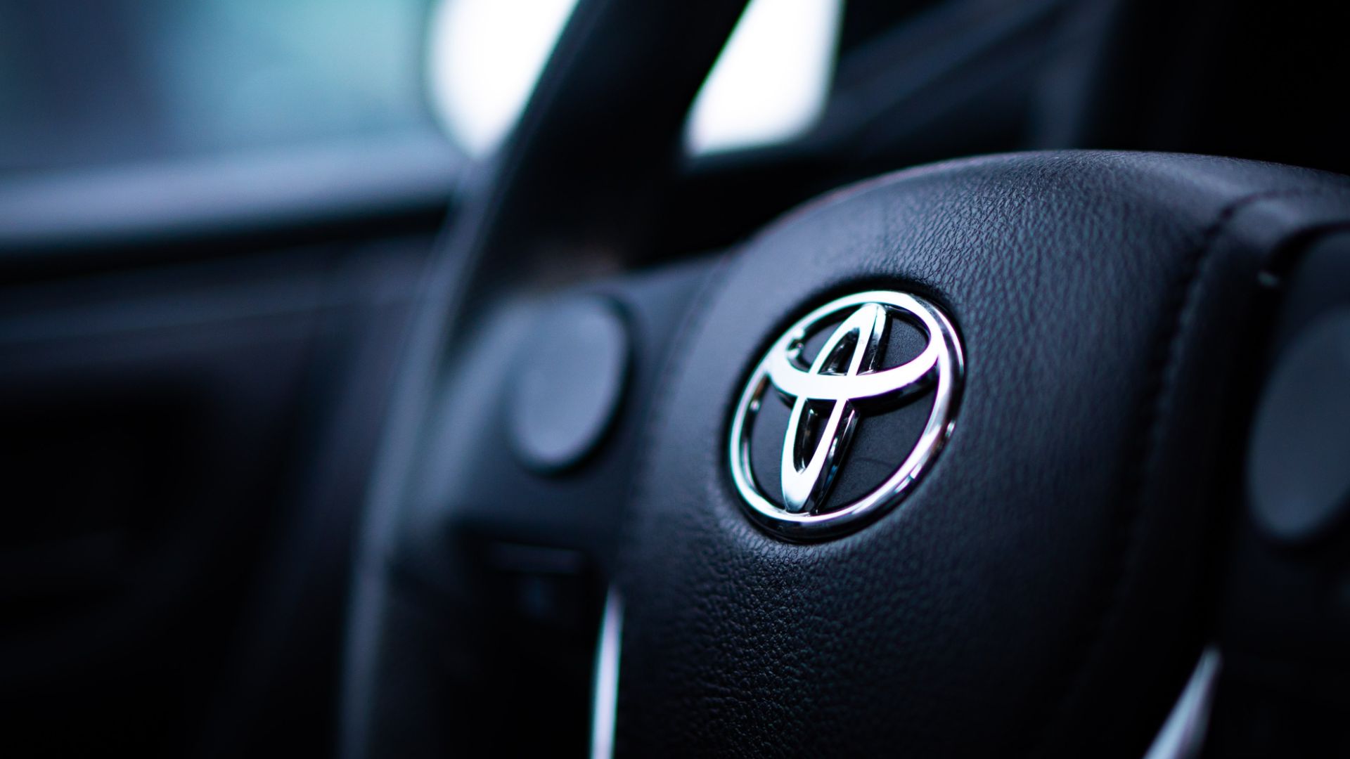 a close up of the steering wheel of a car.