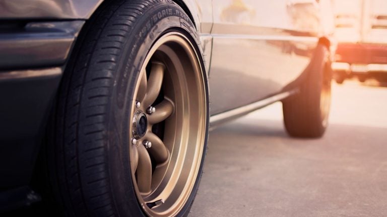 a close up of a tire on a car.