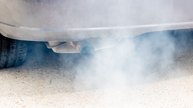 a close up of a car with smoke coming out of it.